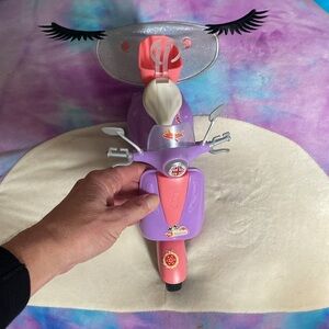 Barbie plastic bike really cute preowned. My twins used it.